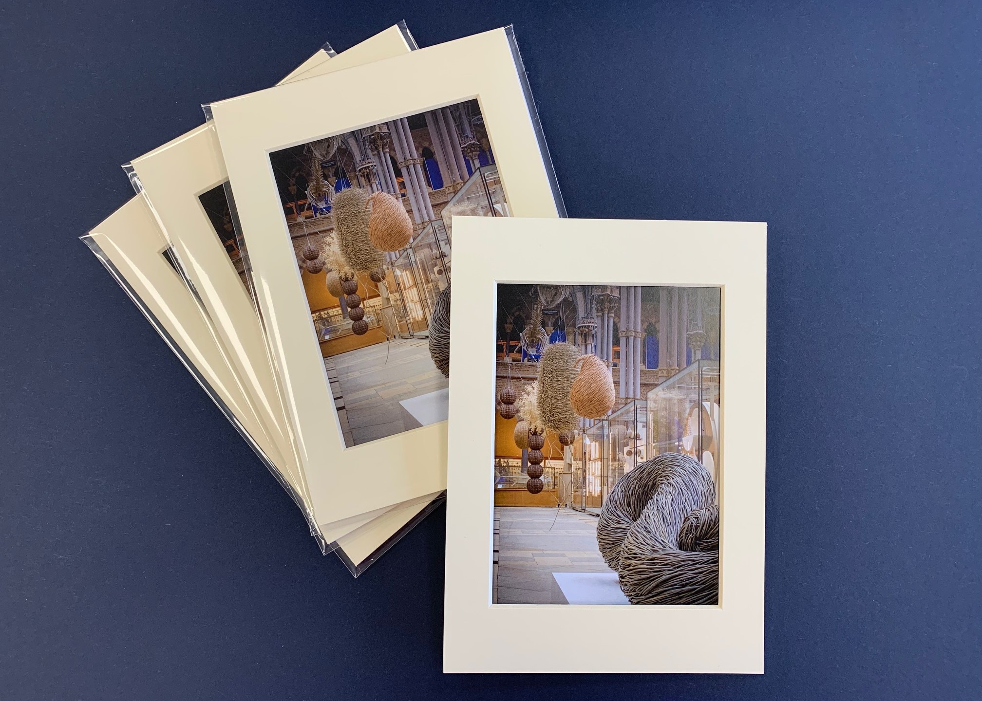 Mounted photographic prints in cellophane envelopes